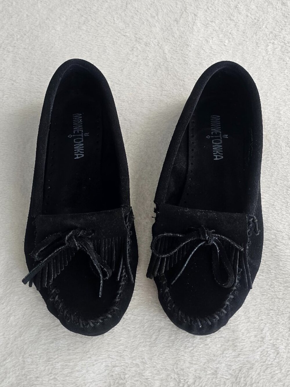 Minnetonka Women's Kilty Suede Moccasin shoes in black